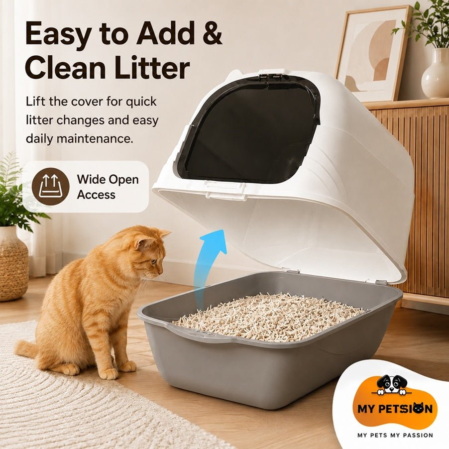 Enclosed cat litter box with lifted cover and wide access opening, shown with orange cat and litter mat in home interior.