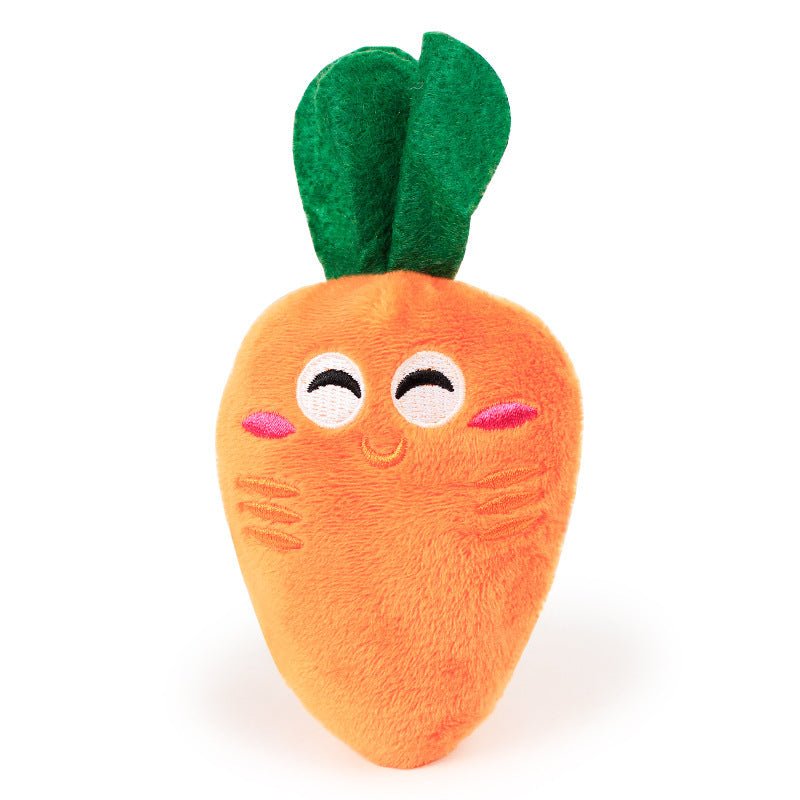 Carrot plush toy with green leaves and happy embroidered face for interactive pet foraging games.