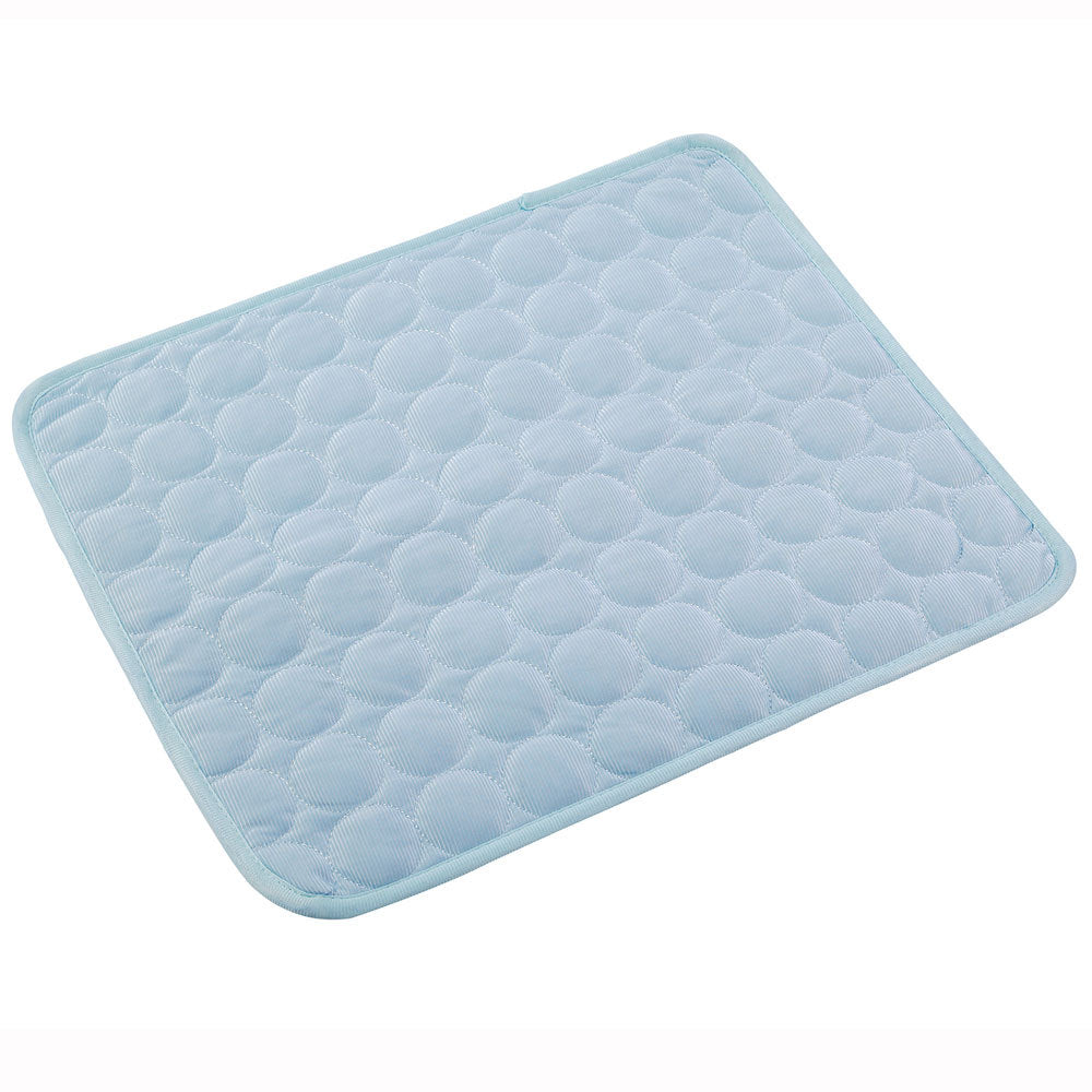 Light blue ice silk pet cooling mat with quilted bubble texture for dogs and cats.
