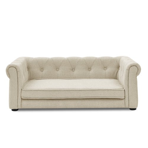 Beige luxury dog bed with Chesterfield design, plush upholstery and rolled arms for medium and large dogs.