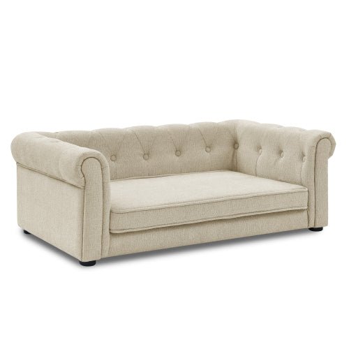 Beige luxury dog bed with rolled arms and button tufted design for medium and large dogs.