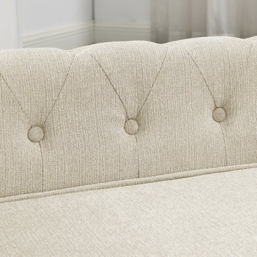 Beige luxury dog bed with tufted button headboard detail, plush washable fabric for medium and large dogs.