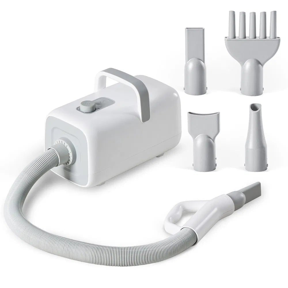 White handheld vacuum cleaner with attachments on a white background