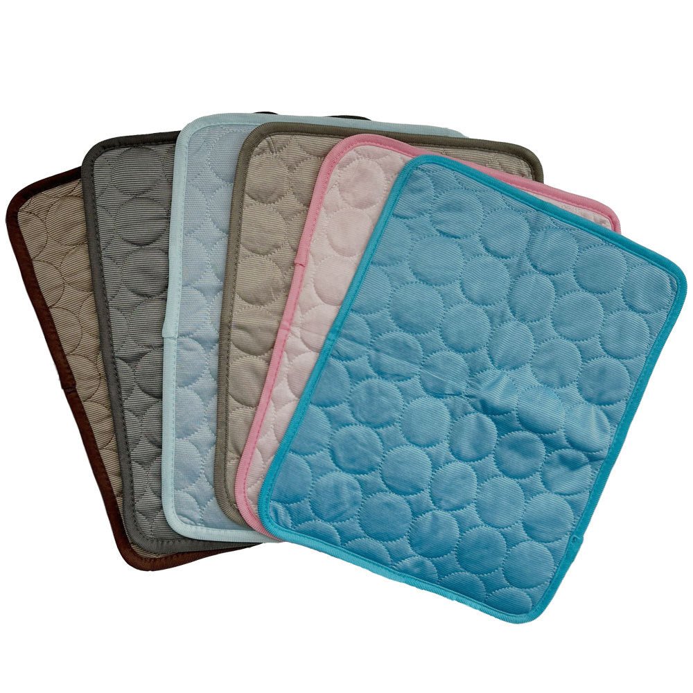 Six pet cooling mats in assorted colors with quilted circular pattern design and colored trim borders.